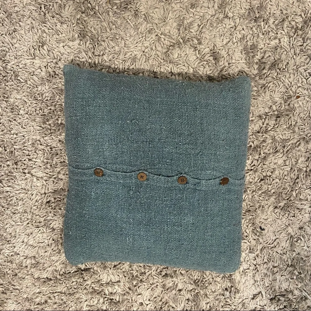 West Elm feather stuffed blue tweed pillow with wooden buttons